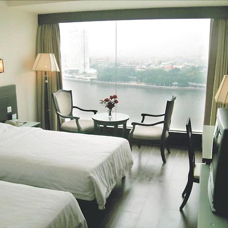 Hotel Jiang Yue à Canton Chambre photo